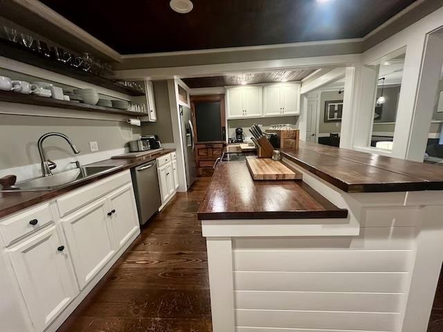 33 Newbury Heights Rd, Newbury, NH 03255 - kitchen with stainless steel appliances, wood counters, dark wood-style flooring, white cabinetry, and open shelves