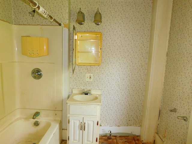 336 Main St, Wakefield, NH 03887 - bathroom featuring wallpapered walls, vanity, and washtub / shower combination