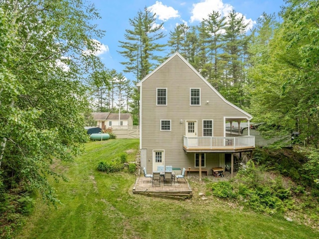82 Robinhood Rd, Wakefield, NH 03830 - back of house with a deck, a lawn, and outdoor dining space