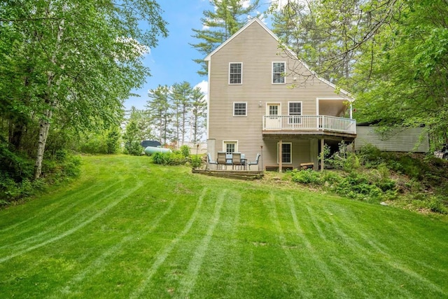 82 Robinhood Rd, Wakefield, NH 03830 - back of property featuring a deck and a lawn