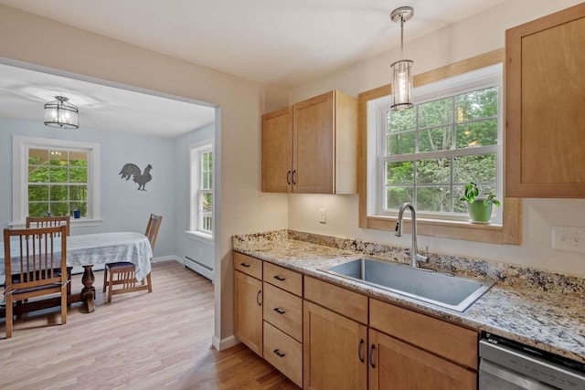 82 Robinhood Rd, Wakefield, NH 03830 - kitchen with stainless steel dishwasher, light wood finished floors, hanging light fixtures, baseboard heating, and light stone counters