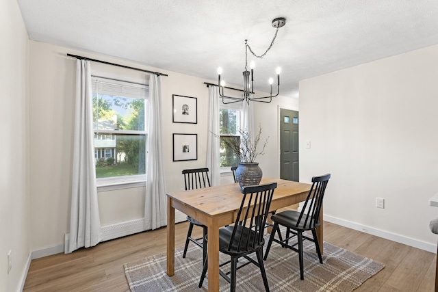 15 Wildflower Dr, Concord, NH 03303 - dining space featuring a chandelier and light wood-style floors
