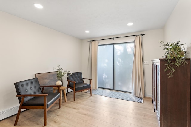 15 Wildflower Dr, Concord, NH 03303 - sitting room with light wood finished floors and recessed lighting