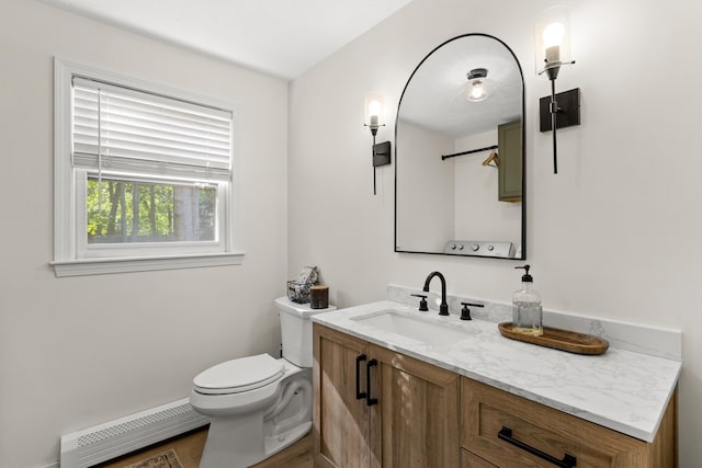 15 Wildflower Dr, Concord, NH 03303 - bathroom with baseboard heating and vanity