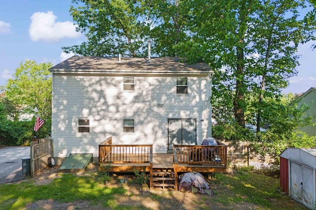 15 Wildflower Dr, Concord, NH 03303 - rear view of property with a wooden deck and a shed