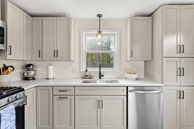 15 Wildflower Dr, Concord, NH 03303 - kitchen featuring appliances with stainless steel finishes, light countertops, and decorative light fixtures