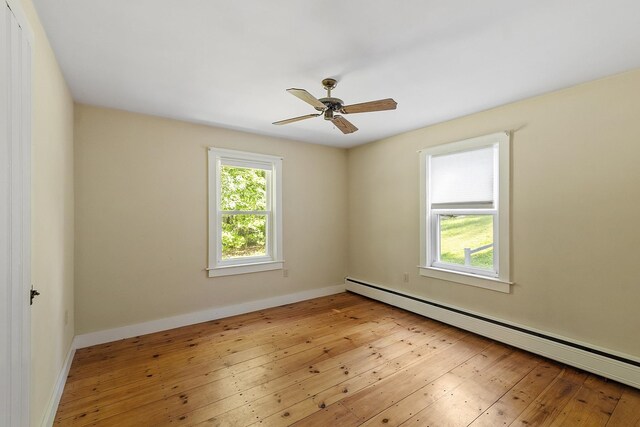 27 Mason Rd, Brookline, NH 03033 - spare room with baseboard heating, light wood-style flooring, and ceiling fan