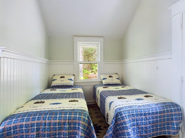 312 Roy Rd, Stewartstown, NH 03576 - bedroom with lofted ceiling and a wainscoted wall