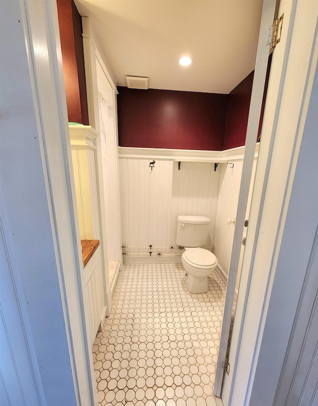 312 Roy Rd, Stewartstown, NH 03576 - bathroom with toilet and wainscoting