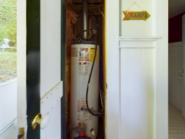 312 Roy Rd, Stewartstown, NH 03576 - utility room with gas water heater