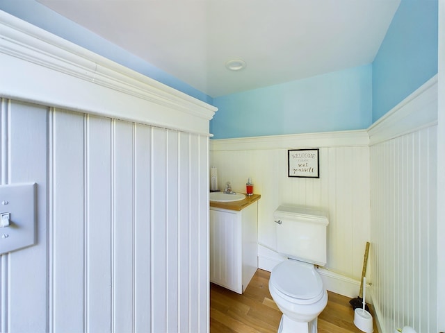 312 Roy Rd, Stewartstown, NH 03576 - bathroom with wood finished floors and a wainscoted wall