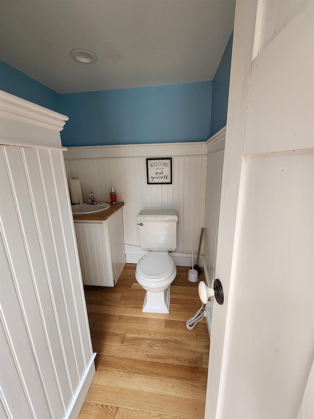 312 Roy Rd, Stewartstown, NH 03576 - half bath featuring wainscoting, wood finished floors, and vanity