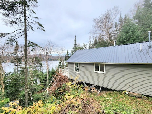 312 Roy Rd, Stewartstown, NH 03576 - view of property exterior with a metal roof