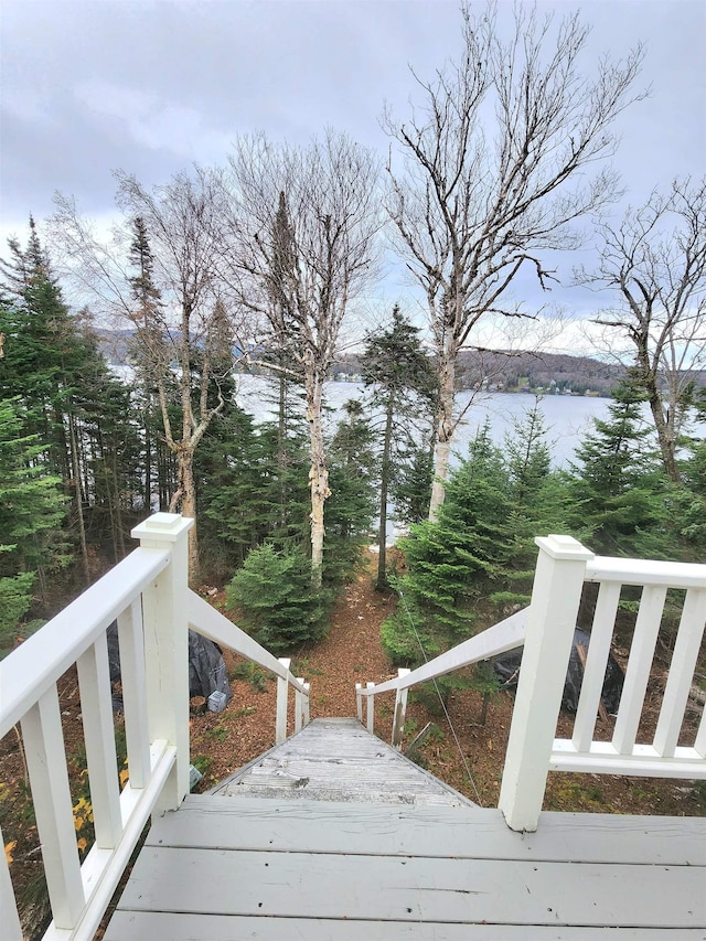 312 Roy Rd, Stewartstown, NH 03576 - wooden deck with a water view