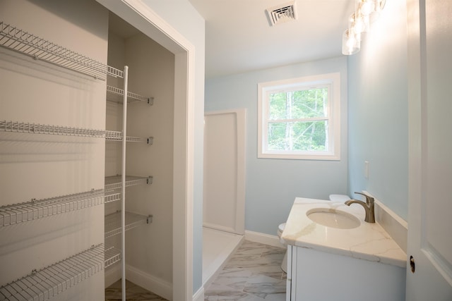 51 Spruce Rd, Middleton, NH 03887 - bathroom featuring marble look tile flooring, vanity, and a shower