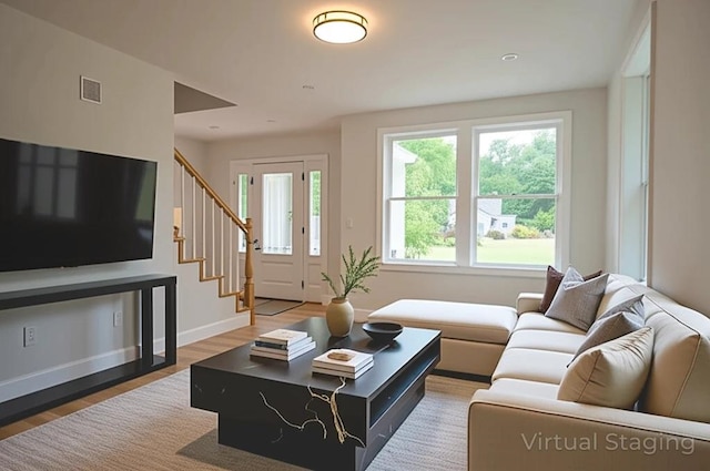 51 Spruce Rd, Middleton, NH 03887 - living area featuring stairs and light wood-type flooring