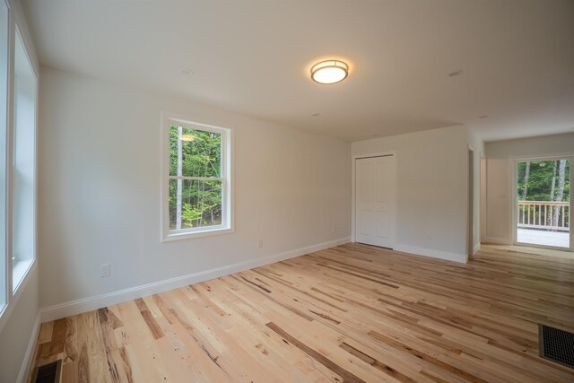 51 Spruce Rd, Middleton, NH 03887 - empty room with wood finished floors and baseboards