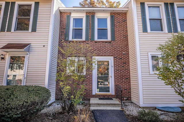 19 Shelburne Rd Unit 19, Merrimack, NH 03054 - view of exterior entry featuring brick siding