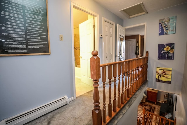 19 Shelburne Rd Unit 19, Merrimack, NH 03054 - hall with a baseboard radiator, an upstairs landing, carpet, and attic access