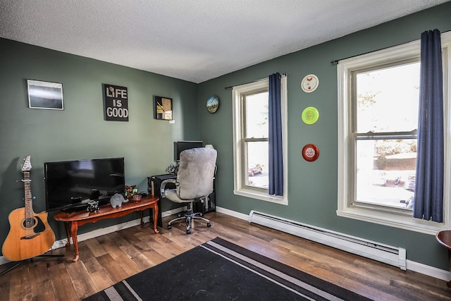 19 Shelburne Rd Unit 19, Merrimack, NH 03054 - office featuring a baseboard radiator, wood finished floors, healthy amount of natural light, and a textured ceiling