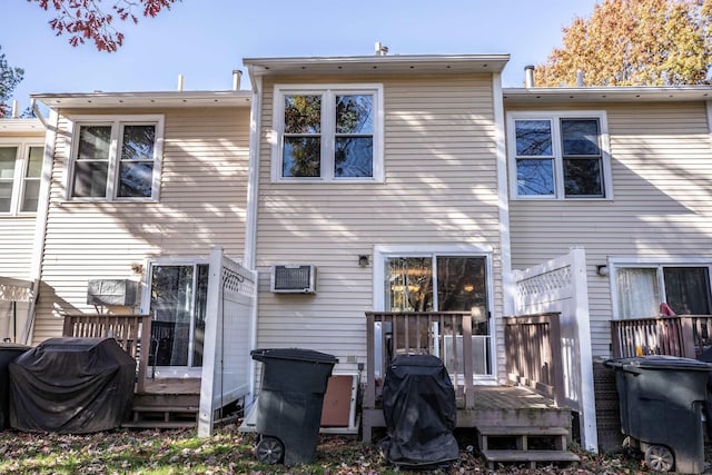 19 Shelburne Rd Unit 19, Merrimack, NH 03054 - back of property featuring a wooden deck and a wall mounted AC