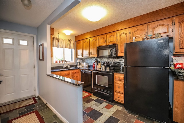 19 Shelburne Rd Unit 19, Merrimack, NH 03054 - kitchen featuring black appliances, a peninsula, dark countertops, tasteful backsplash, and a textured ceiling