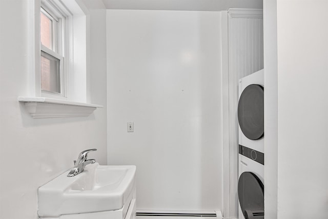 89 College St Unit A-2, Burlington, VT 05401 - washroom with estacked washer and dryer and baseboard heating