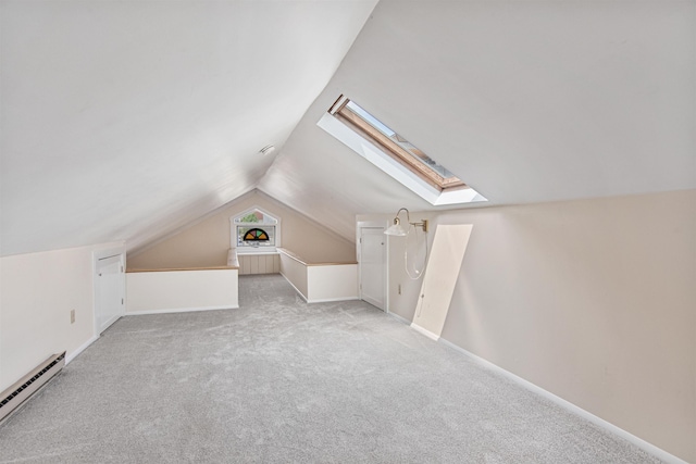 89 College St Unit A-2, Burlington, VT 05401 - bonus room with a skylight, a baseboard heating unit, vaulted ceiling, and light colored carpet