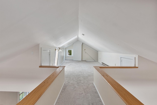 89 College St Unit A-2, Burlington, VT 05401 - additional living space featuring carpet, lofted ceiling, healthy amount of natural light, and a baseboard heating unit