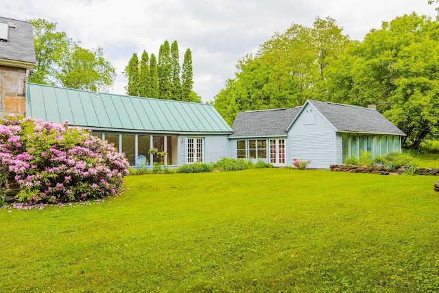 526 River Rd, Lyme, NH 03768 - rear view of house featuring a lawn, french doors, and a standing seam roof