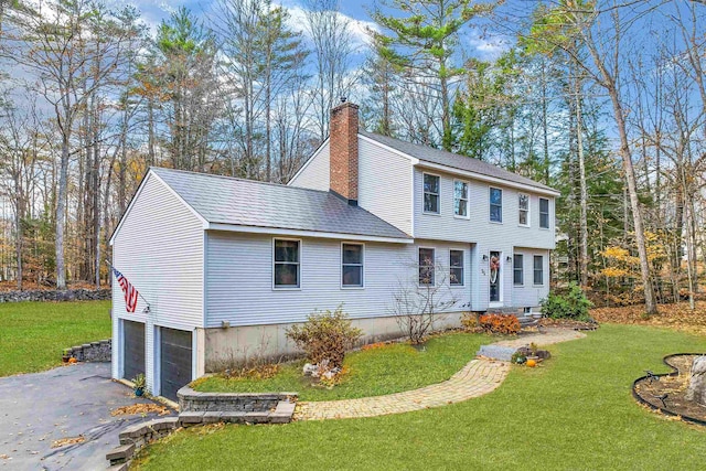 55 Trask Side Rd, Alton, NH 03810 - colonial home featuring a chimney, an attached garage, asphalt driveway, and a front yard