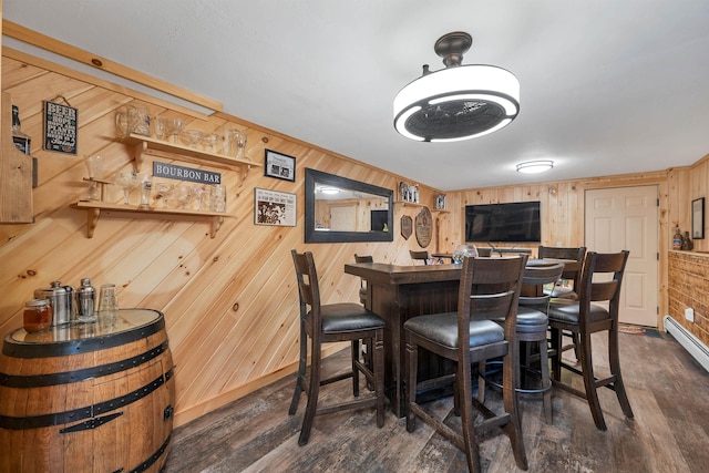 55 Trask Side Rd, Alton, NH 03810 - dining room with wooden walls, a bar, and dark wood finished floors