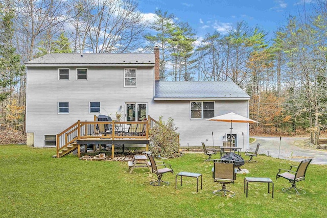 55 Trask Side Rd, Alton, NH 03810 - rear view of property with an outdoor fire pit, a wooden deck, a chimney, and a yard