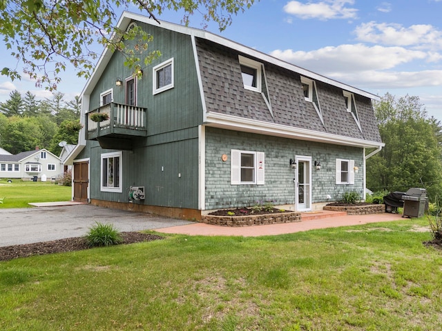183 Summer St, Newport, NH 03773 - back of property featuring a balcony, a shingled roof, a lawn, and a gambrel roof