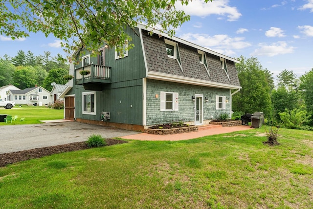 183 Summer St, Newport, NH 03773 - back of house featuring a balcony, a lawn, a shingled roof, and a patio area