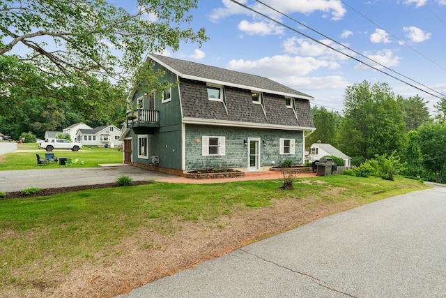 183 Summer St, Newport, NH 03773 - view of side of property featuring a shingled roof, a yard, and a balcony