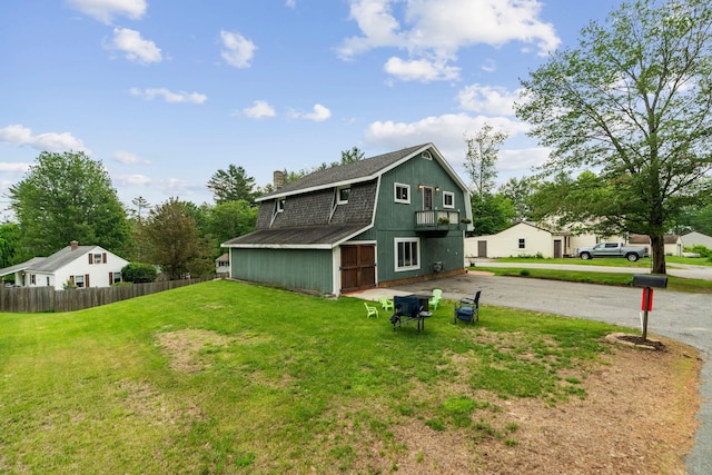 183 Summer St, Newport, NH 03773 - back of house with driveway, a chimney, and roof with shingles