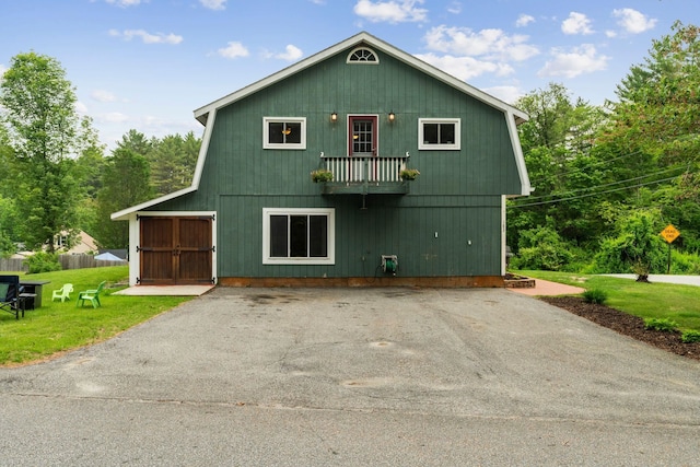 183 Summer St, Newport, NH 03773 - view of front facade with a front lawn, a balcony, and asphalt driveway