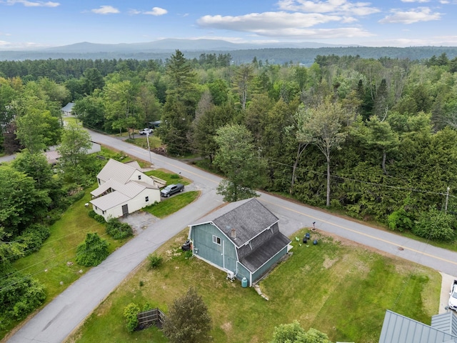 183 Summer St, Newport, NH 03773 - aerial view of property and surrounding area featuring a heavily wooded area and a mountainous background