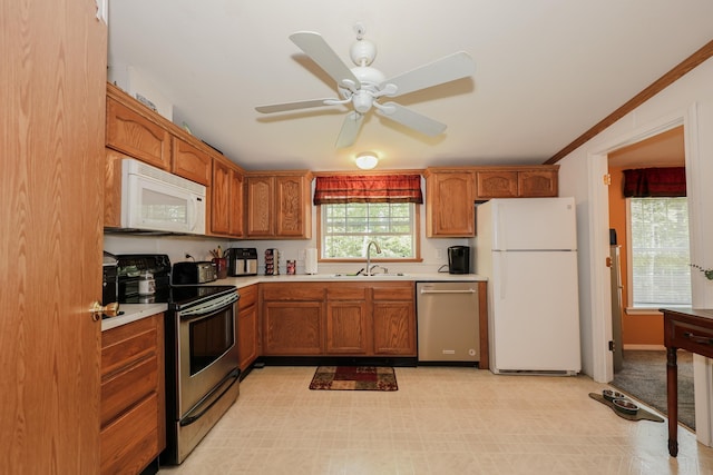 44 Hoit Mill Rd, Weare, NH 03281 - kitchen with stainless steel appliances, light countertops, a ceiling fan, and brown cabinets