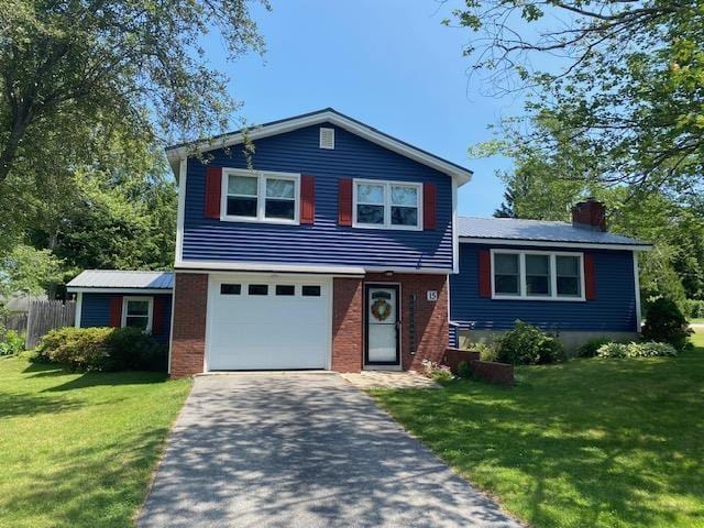 15 Vernon Ave, Rochester, NH 03867 - split level home featuring driveway, a garage, a chimney, and brick siding