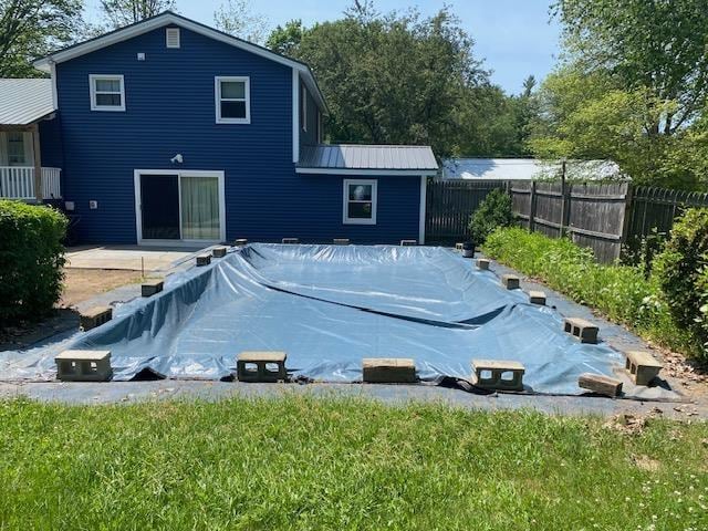15 Vernon Ave, Rochester, NH 03867 - rear view of property with a covered pool