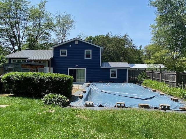 15 Vernon Ave, Rochester, NH 03867 - rear view of house with a covered pool