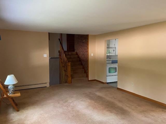 15 Vernon Ave, Rochester, NH 03867 - unfurnished living room with baseboard heating, stairs, and carpet floors