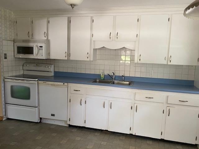 15 Vernon Ave, Rochester, NH 03867 - kitchen with white appliances, decorative backsplash, and white cabinetry