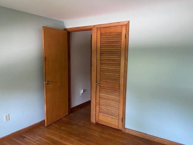 15 Vernon Ave, Rochester, NH 03867 - hallway with dark wood-style floors and baseboards