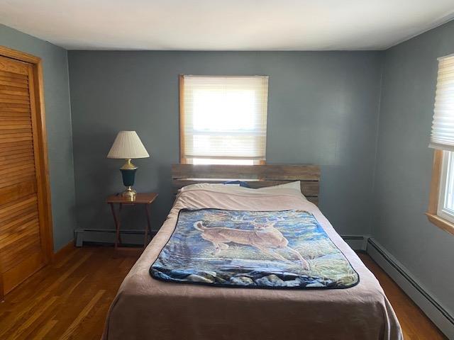 15 Vernon Ave, Rochester, NH 03867 - bedroom featuring baseboard heating and dark wood finished floors