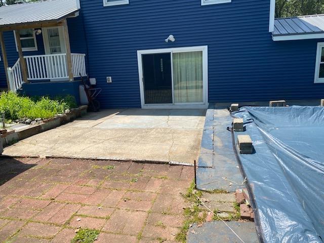 15 Vernon Ave, Rochester, NH 03867 - covered porch featuring a patio area