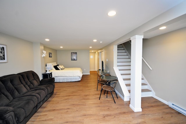 17 Village W Dr Unit 11, Bristol, NH 03222 - bedroom featuring recessed lighting, light wood-type flooring, and a baseboard radiator