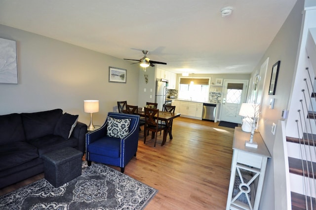 17 Village W Dr Unit 11, Bristol, NH 03222 - living area featuring light wood-style flooring and ceiling fan